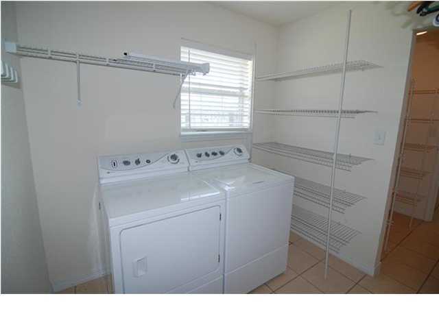 207 Shipwreck Road Santa Rosa Beach, FL 32459 - Photo 8 of 23 a utility room with dryer and washer