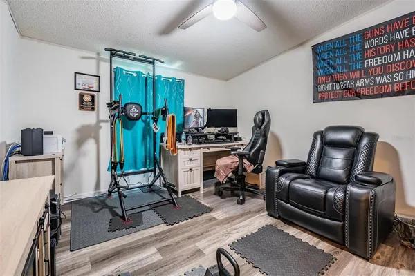 a view of a workspace with furniture and a workspace