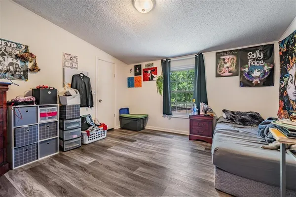 a bedroom with furniture and a gate