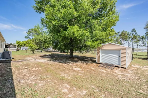 a view of backyard with green space