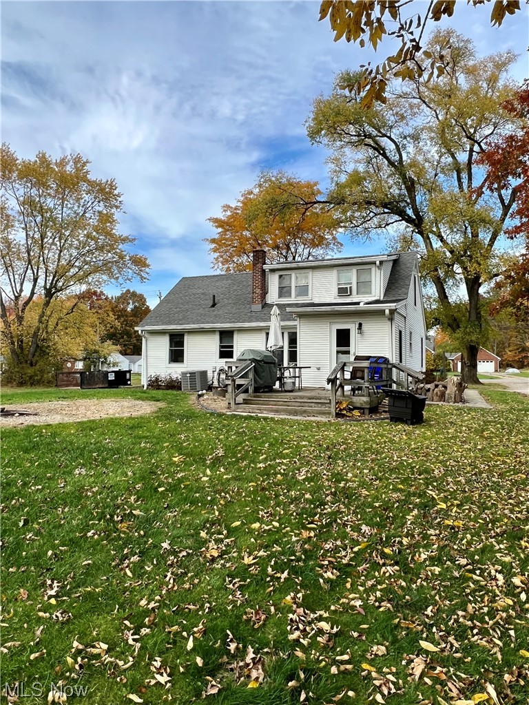 3992 Tallmadge Road Rootstown, OH 44272 - Photo 22 of 27 Back of house with a lawn and a deck