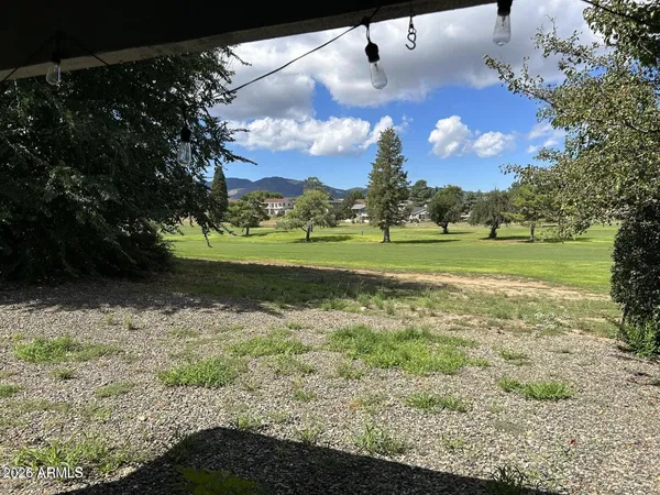 a view of a golf course with a big yard