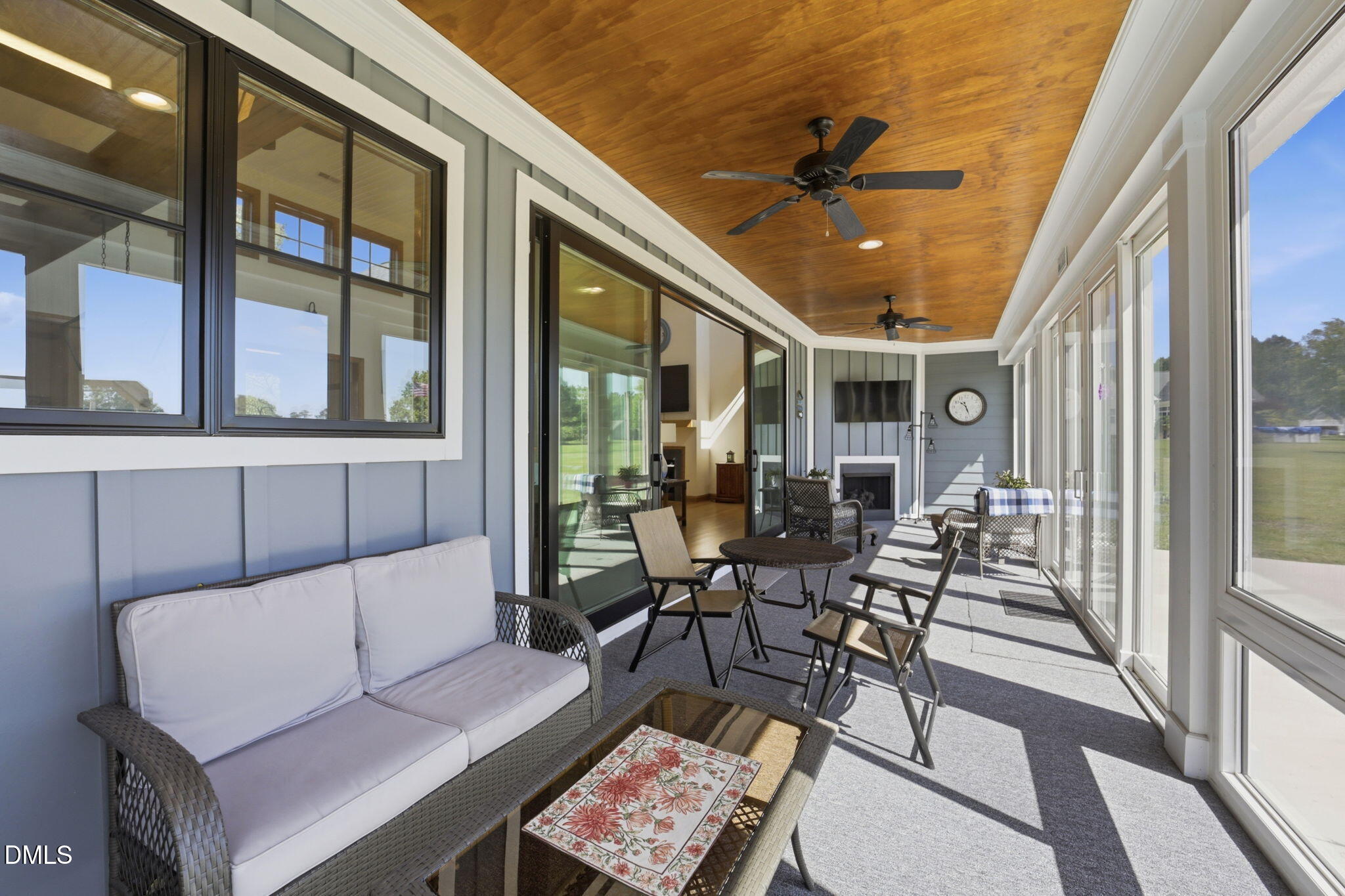 35 North Rippling Court Smithfield, NC 27577 - Photo 19 of 59 a view of a patio with a dining table and chairs