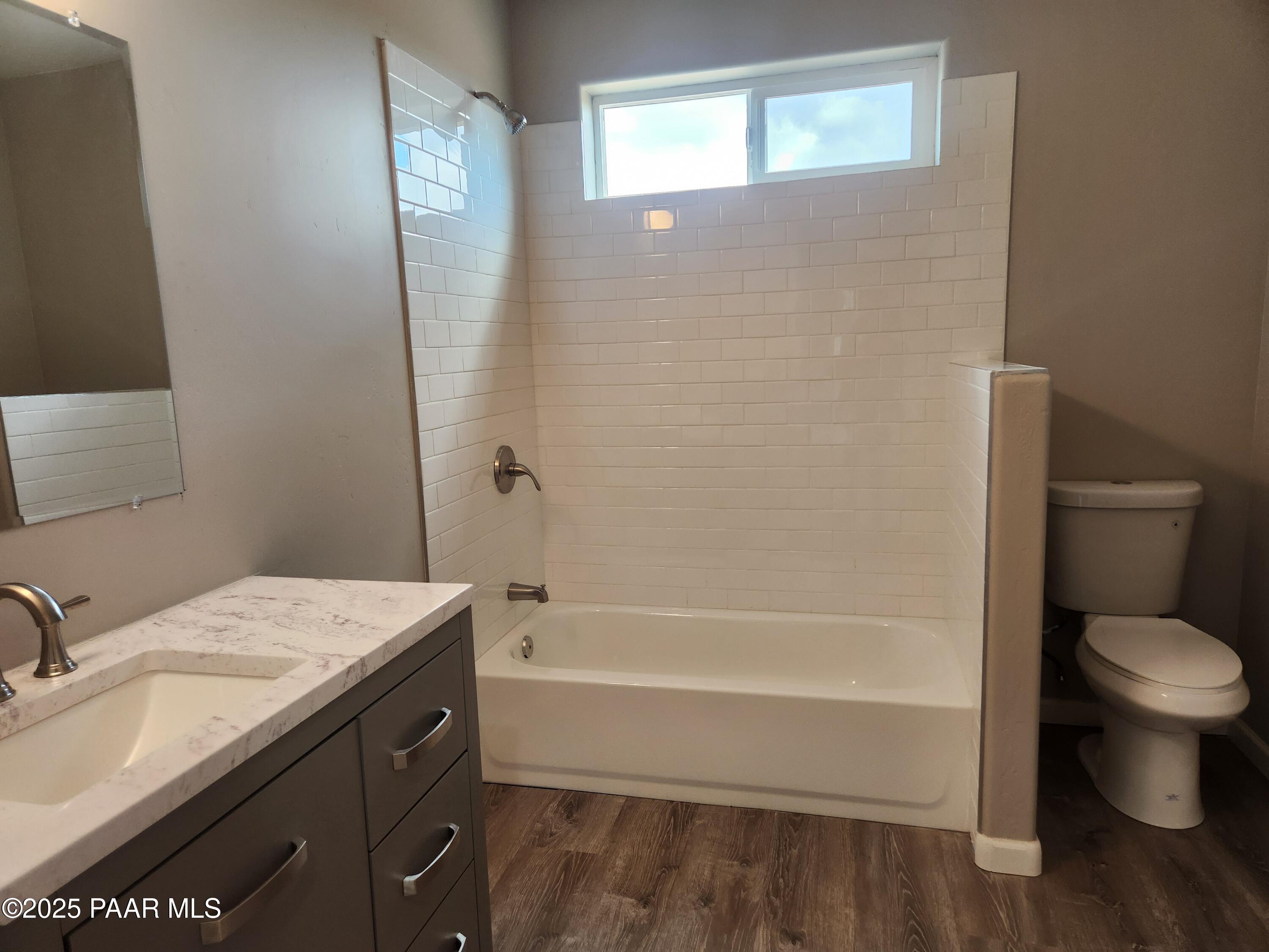 895 Ranch House Road Paulden, AZ 86334 - Photo 12 of 21 a bathroom with a granite countertop sink toilet and shower