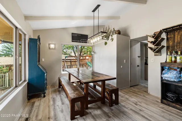 a view of a livingroom with furniture window and wooden floor
