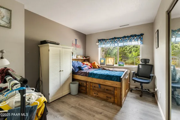 a bed room with furniture and a window