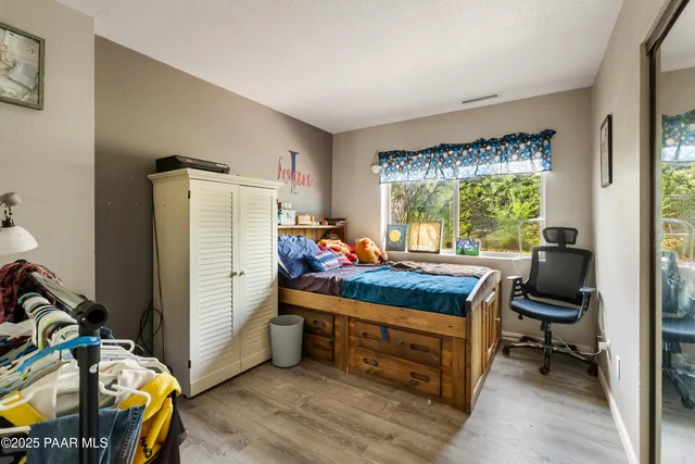 a bed room with furniture and a window