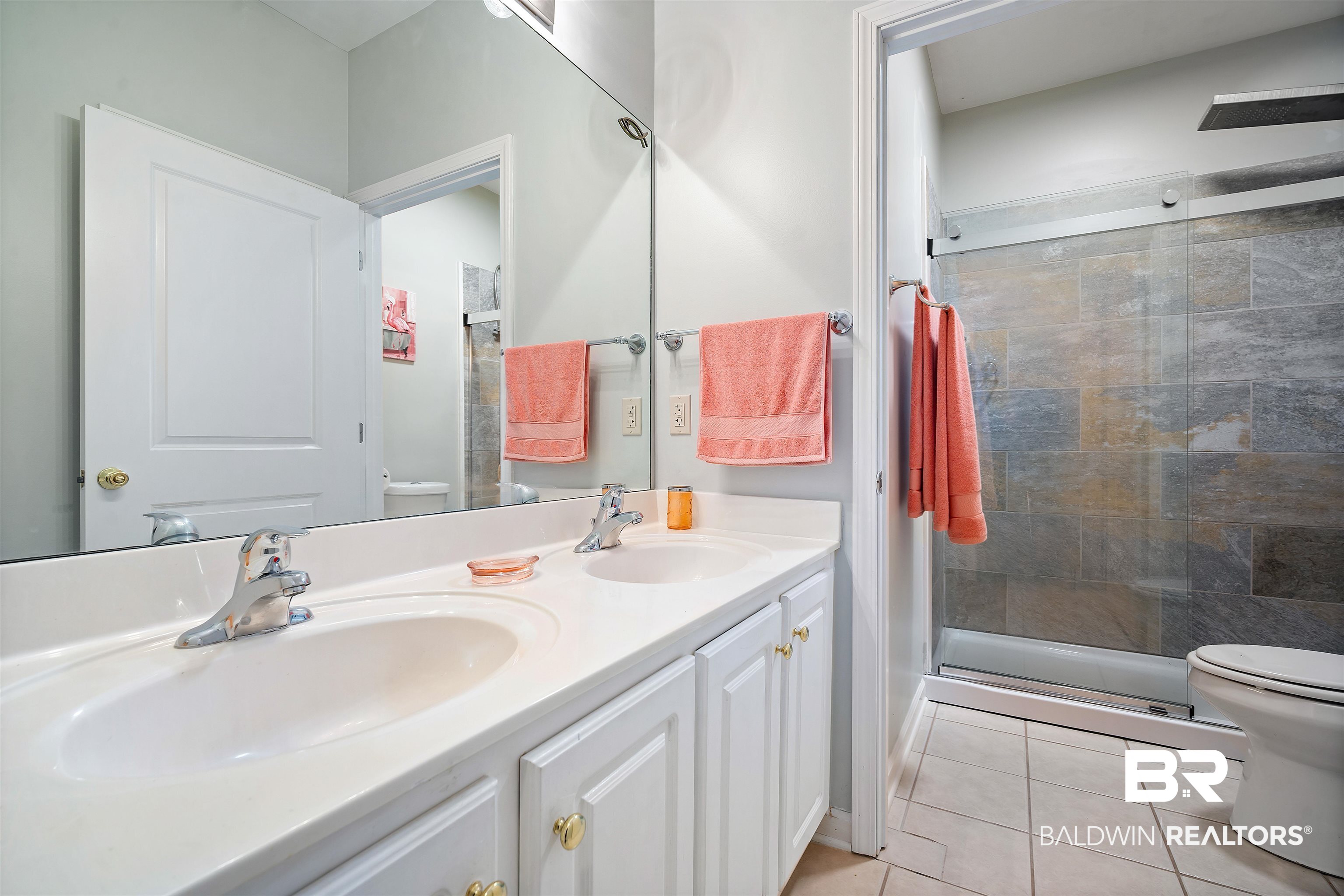 615 Summerlake Place Mobile, AL 36608 - Photo 24 of 35 Bathroom with double vanity, light tile patterned flooring, and a stall shower