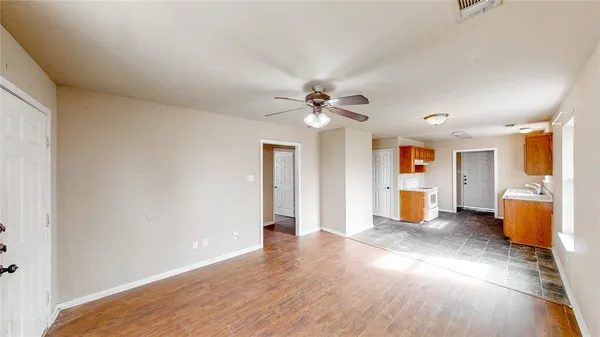 a view of a kitchen with a sink and a window