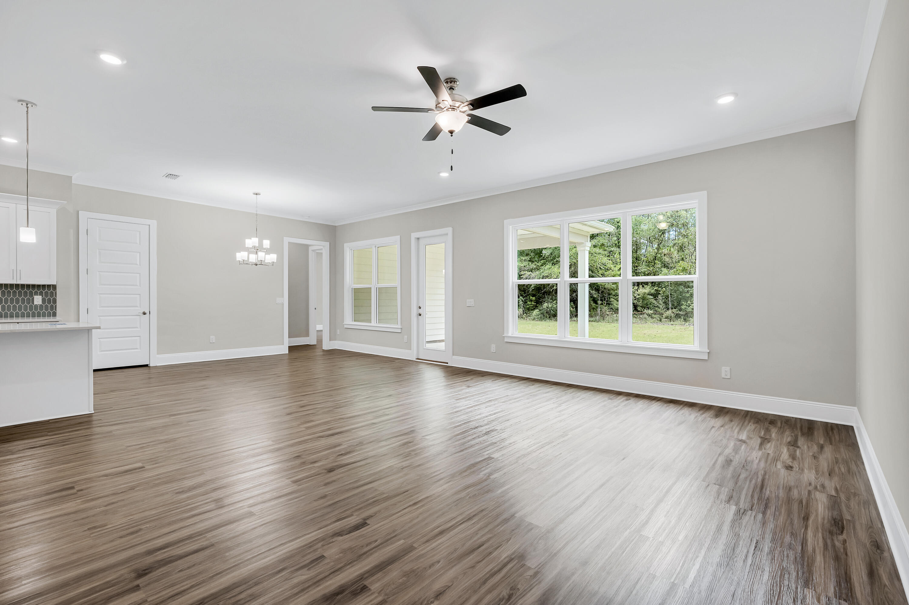 0 South J Hunter's Way, Unit LOT 18 Freeport, FL 32439 - Photo 13 of 36 a view of an empty room with wooden floor and a window