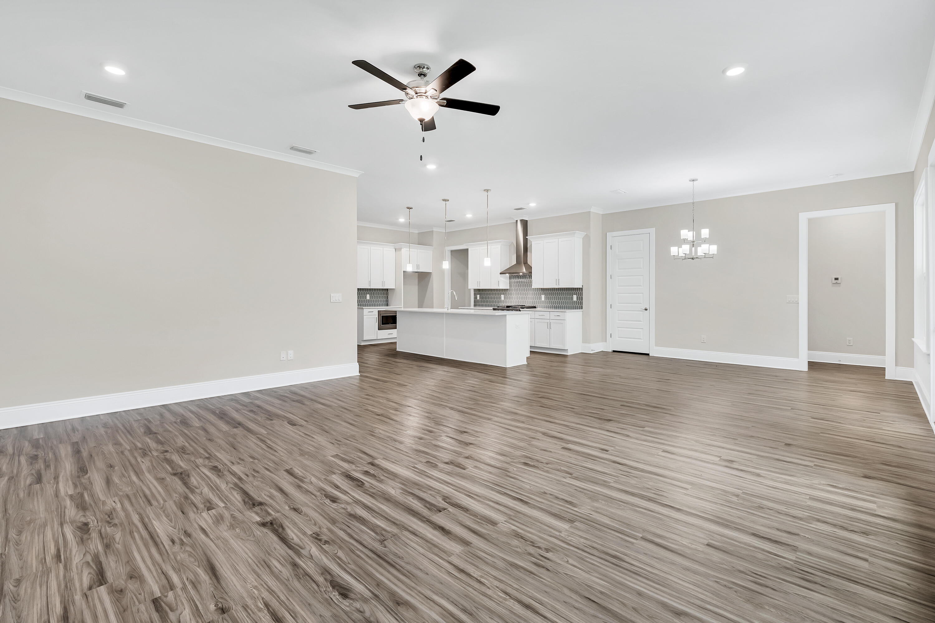 0 South J Hunter's Way, Unit LOT 18 Freeport, FL 32439 - Photo 14 of 36 a view of kitchen with cabinets and wooden floor