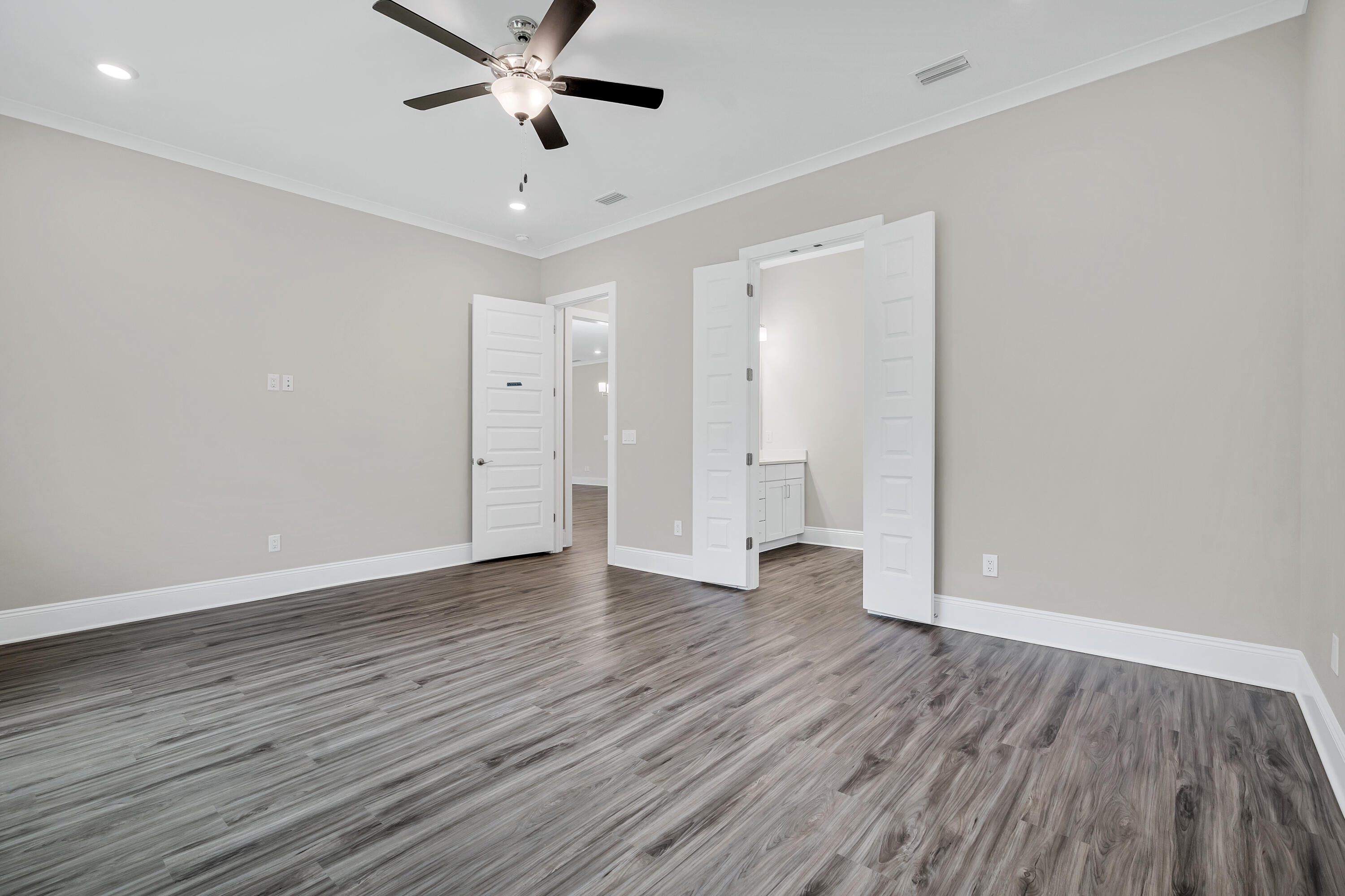 0 South J Hunter's Way, Unit LOT 18 Freeport, FL 32439 - Photo 19 of 36 a view of an empty room with wooden floor