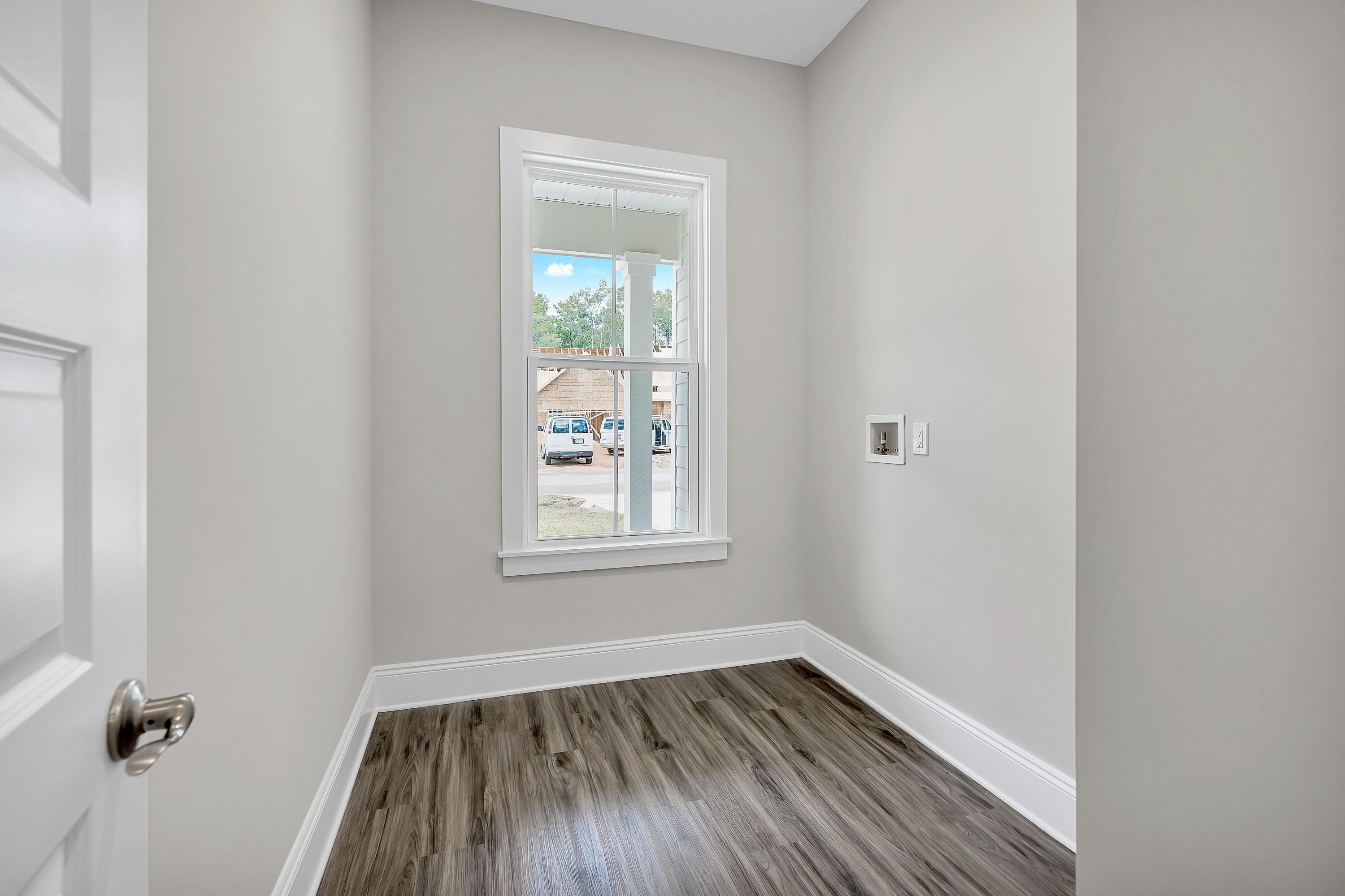 0 South J Hunter's Way, Unit LOT 18 Freeport, FL 32439 - Photo 29 of 36 a view of an empty room with wooden floor and a window