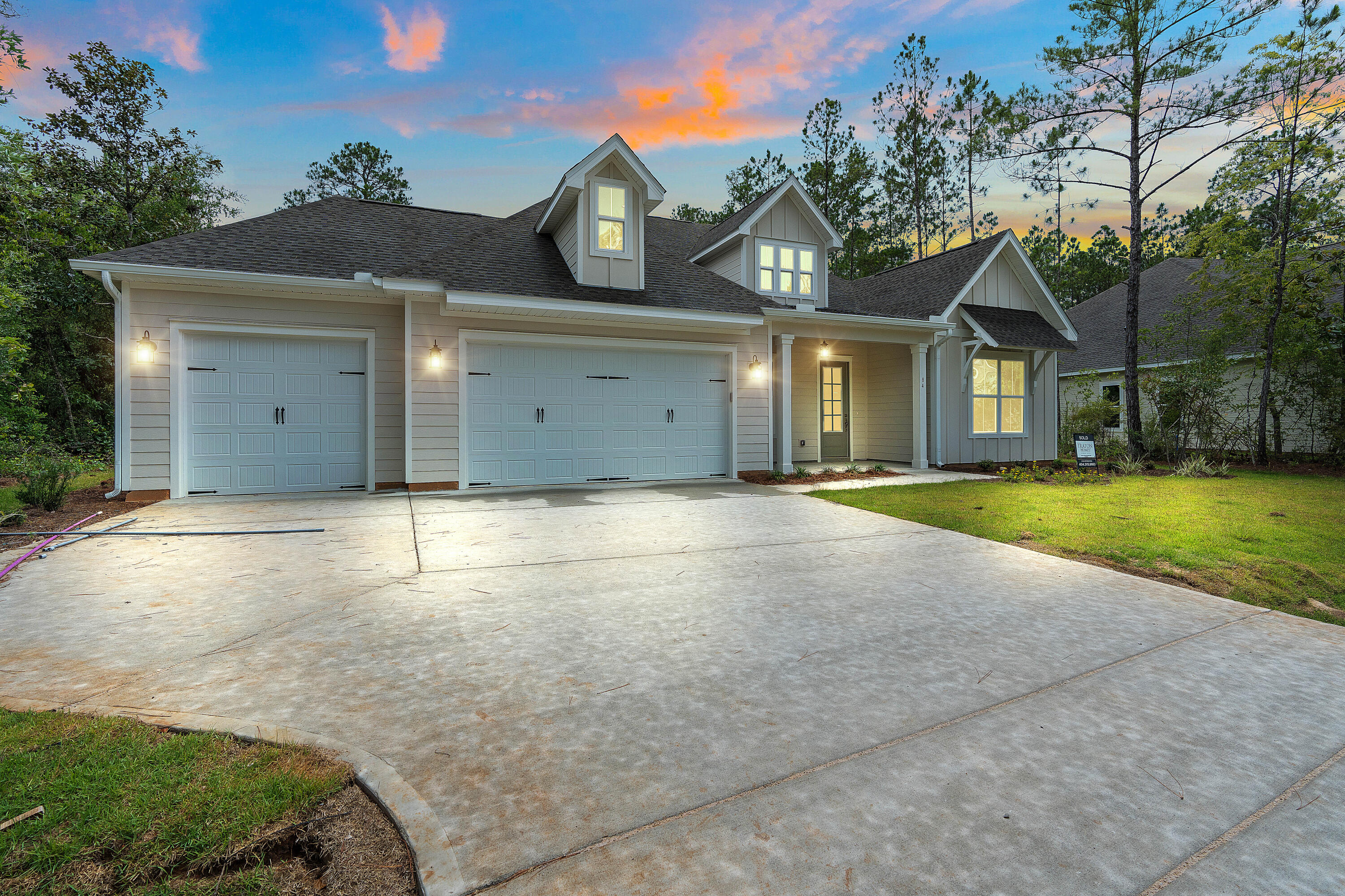 0 South J Hunter's Way, Unit LOT 18 Freeport, FL 32439 - Photo 3 of 36 a view of a house with a yard and large tree