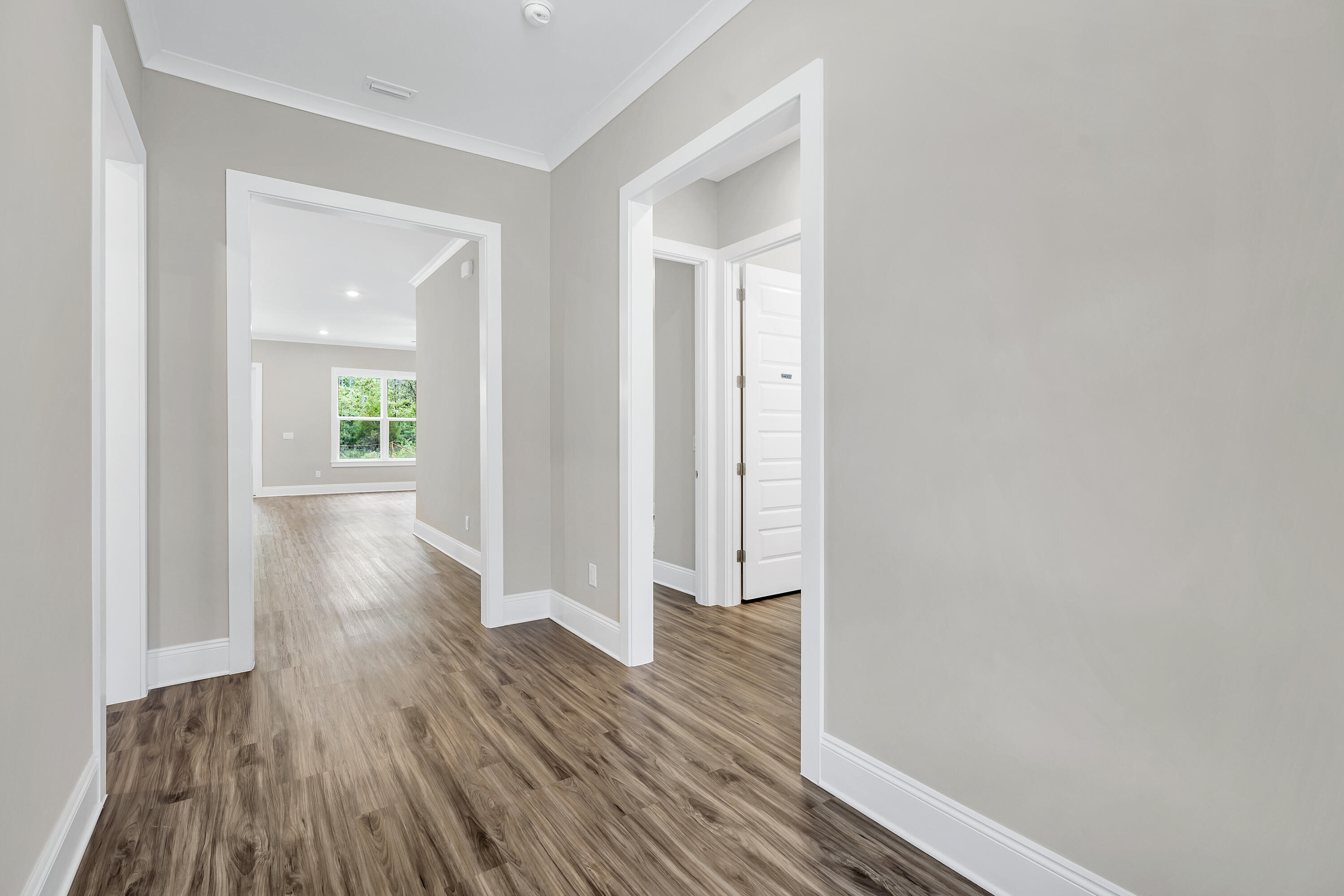 0 South J Hunter's Way, Unit LOT 18 Freeport, FL 32439 - Photo 4 of 36 a view of a hallway with wooden floor