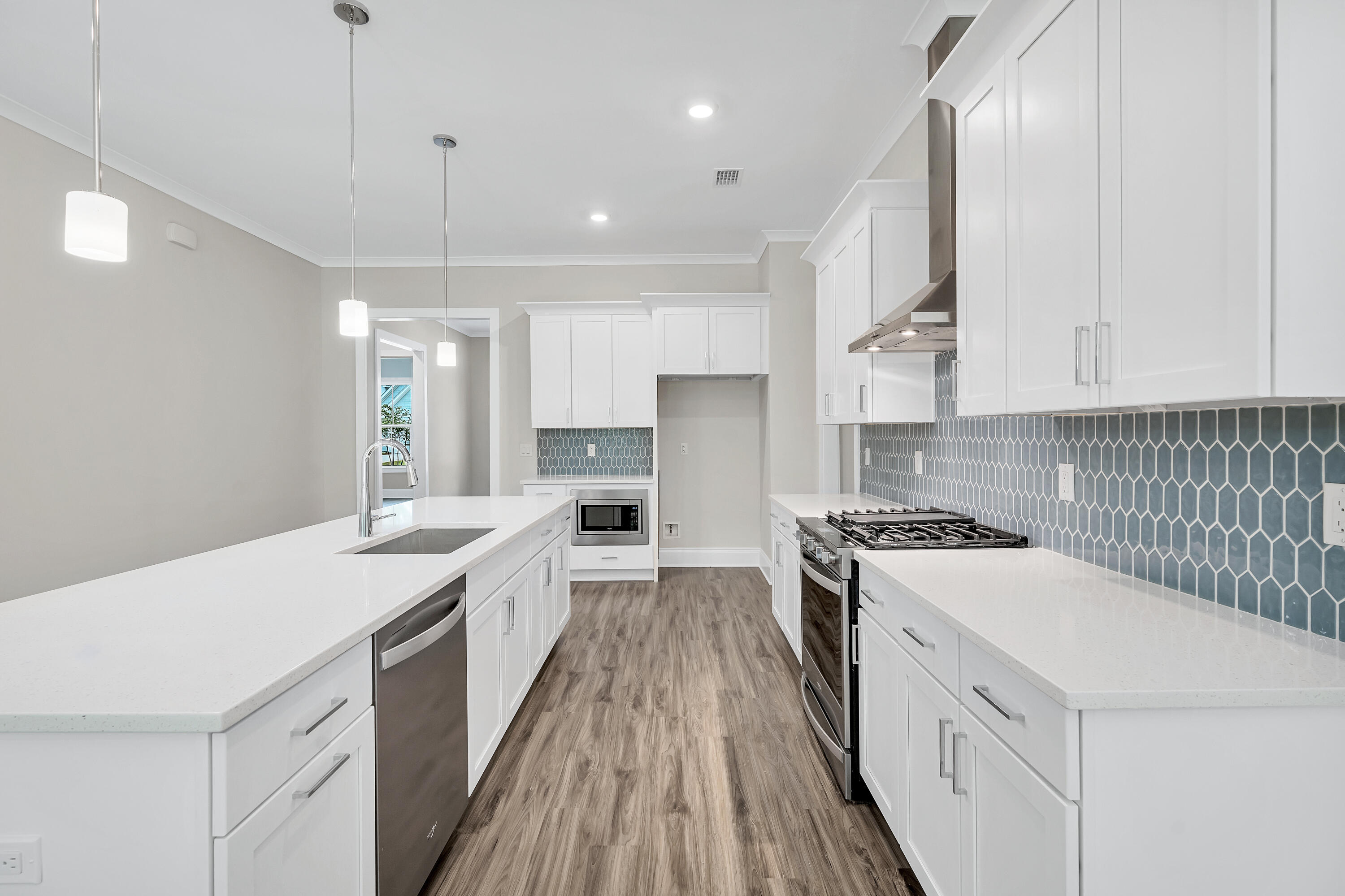 0 South J Hunter's Way, Unit LOT 18 Freeport, FL 32439 - Photo 9 of 36 a kitchen with granite countertop a sink a counter top space stainless steel appliances and cabinets
