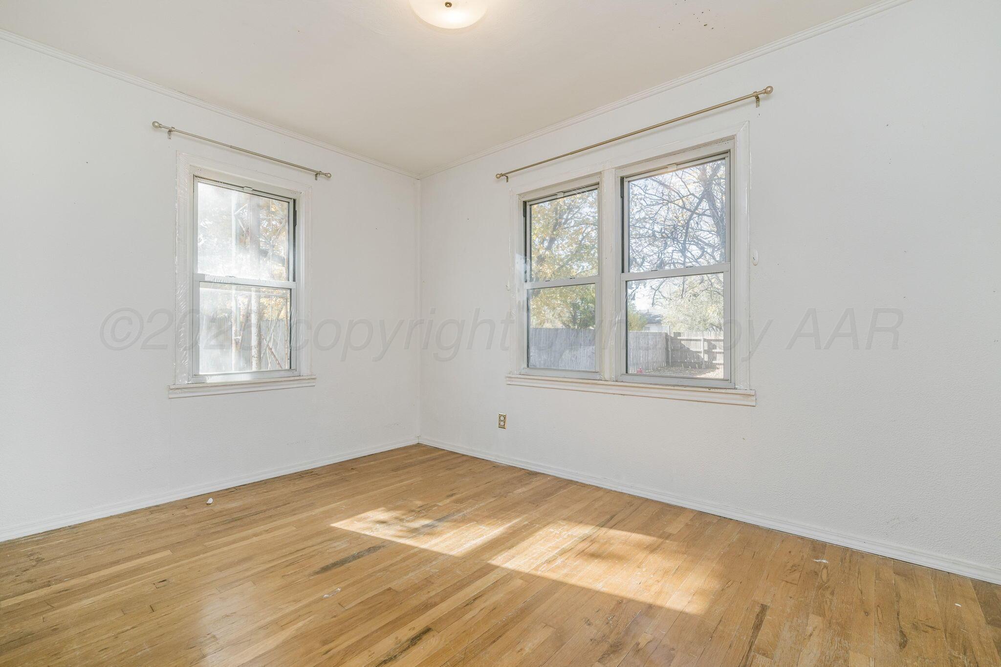 2133 Hamilton Street Pampa, TX 79065 - Photo 15 of 21 a view of empty room with window