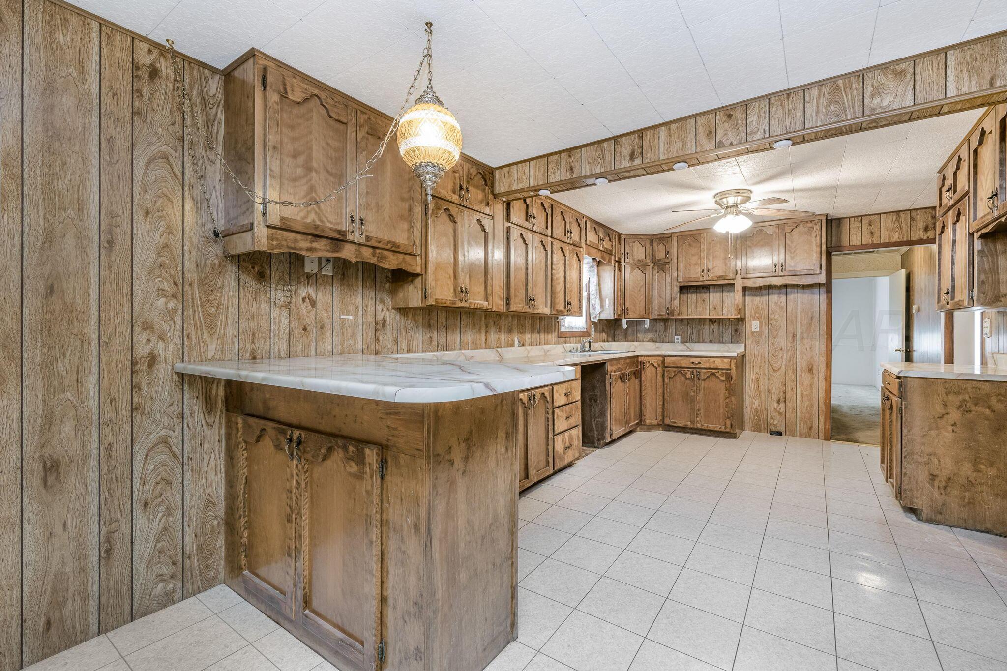 2133 Hamilton Street Pampa, TX 79065 - Photo 6 of 21 a kitchen with stainless steel appliances granite countertop a sink counter space cabinets and a sink
