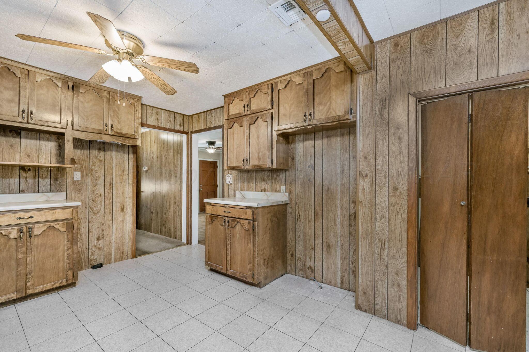 2133 Hamilton Street Pampa, TX 79065 - Photo 7 of 21 a kitchen with stainless steel appliances a refrigerator and a sink