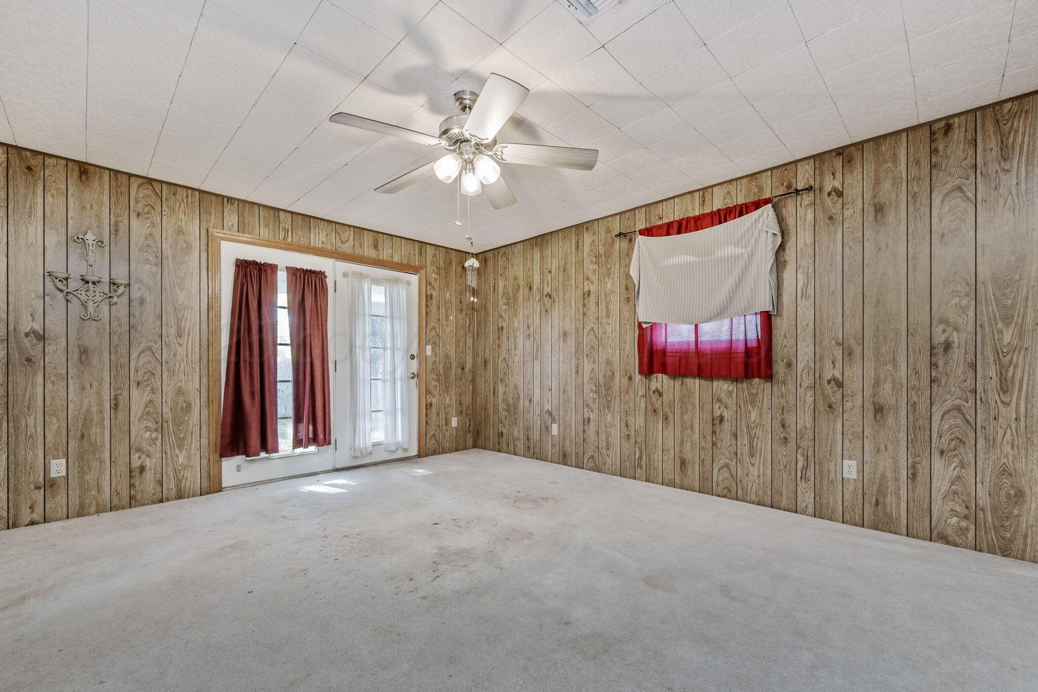 2133 Hamilton Street Pampa, TX 79065 - Photo 10 of 21 a view of a livingroom with a ceiling fan and window
