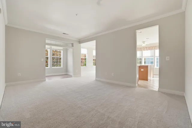 a kitchen with a refrigerator a microwave a sink and a stove