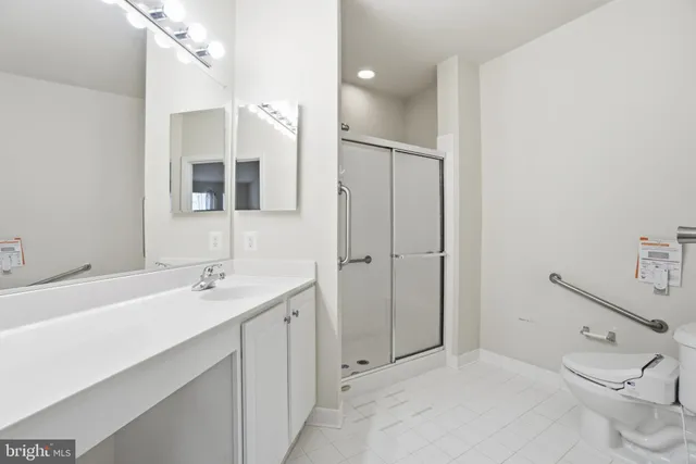 a front view of a building with a garden and plants