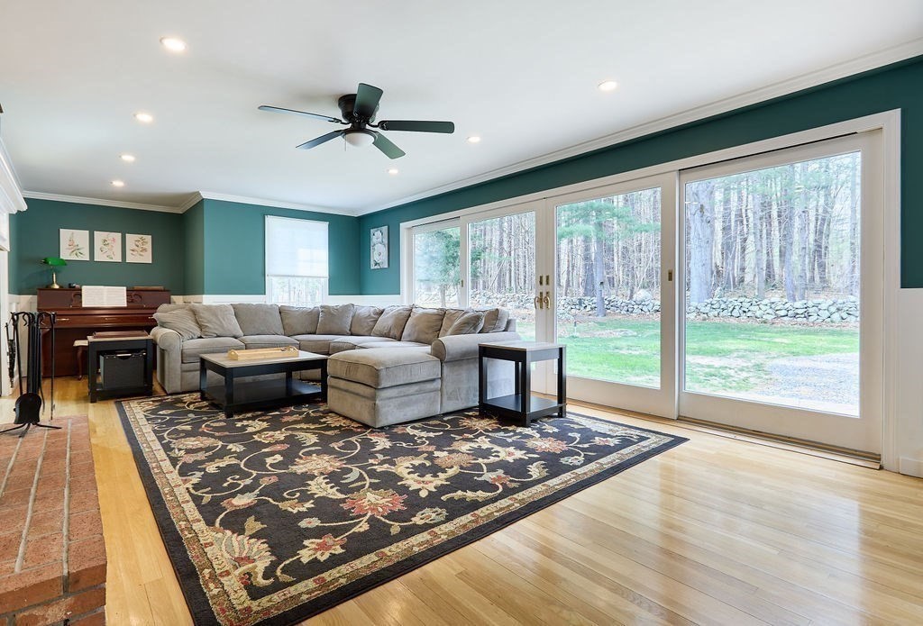 58 Buttercup Lane Hanover, MA 02339 - Photo 7 of 35 a living room with furniture and a rug
