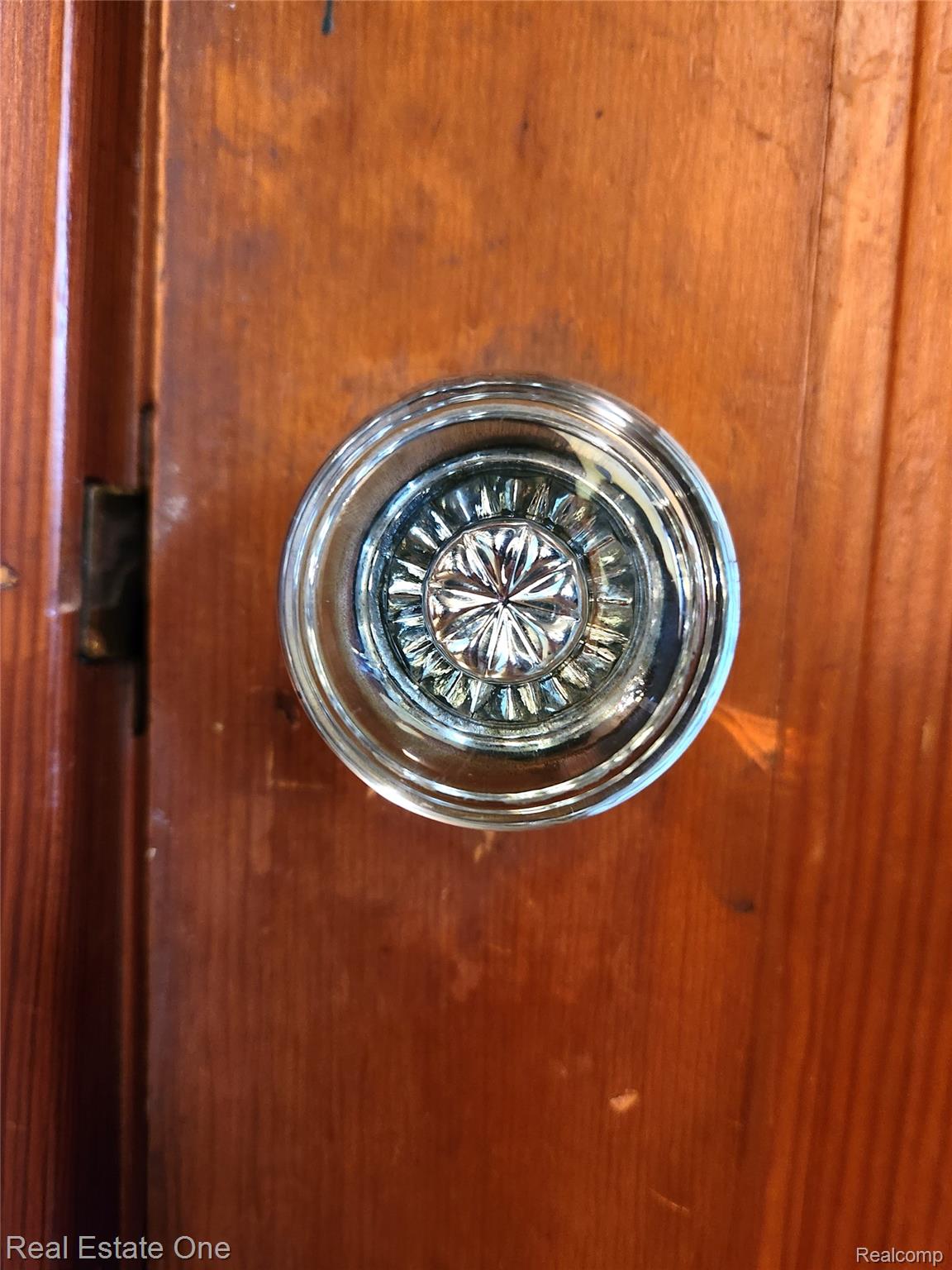2153 Wiltshire Road Berkley, MI 48072 - Photo 10 of 18 Wood-finish door with a clear glass doorknob featuring a faceted design
