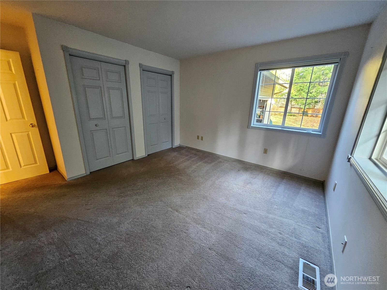 1121 East Old Ranch Road Allyn, WA 98524 - Photo 18 of 30 an empty room with windows