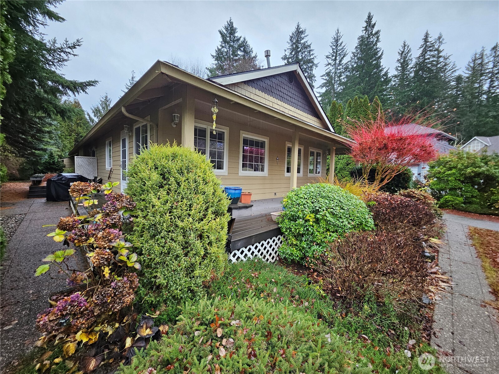 1121 East Old Ranch Road Allyn, WA 98524 - Photo 29 of 30 a front view of house with yard and trees around