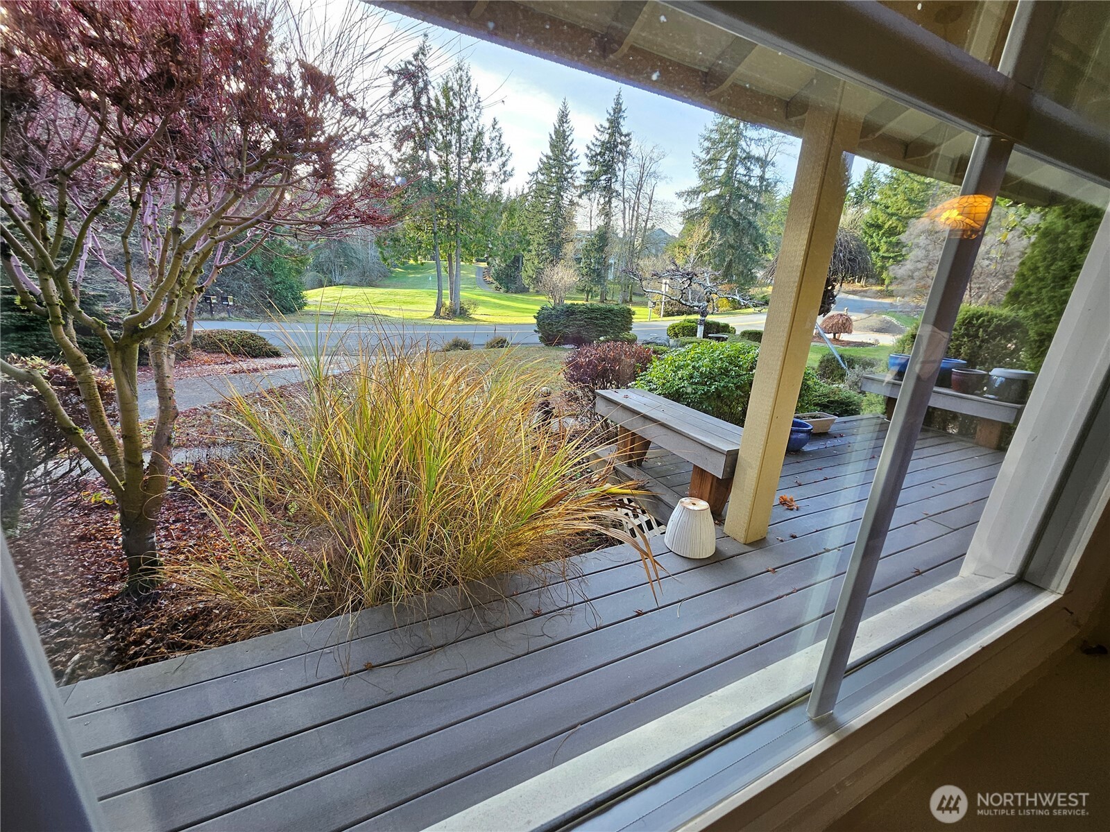 1121 East Old Ranch Road Allyn, WA 98524 - Photo 9 of 30 a view of a wooden deck with sky view