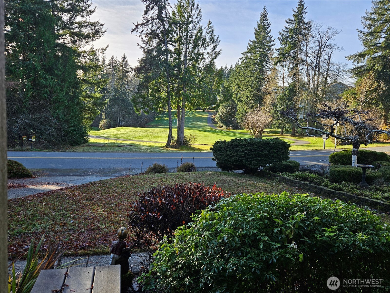 1121 East Old Ranch Road Allyn, WA 98524 - Photo 10 of 30 a view of a swimming pool with an outdoor space and seating area