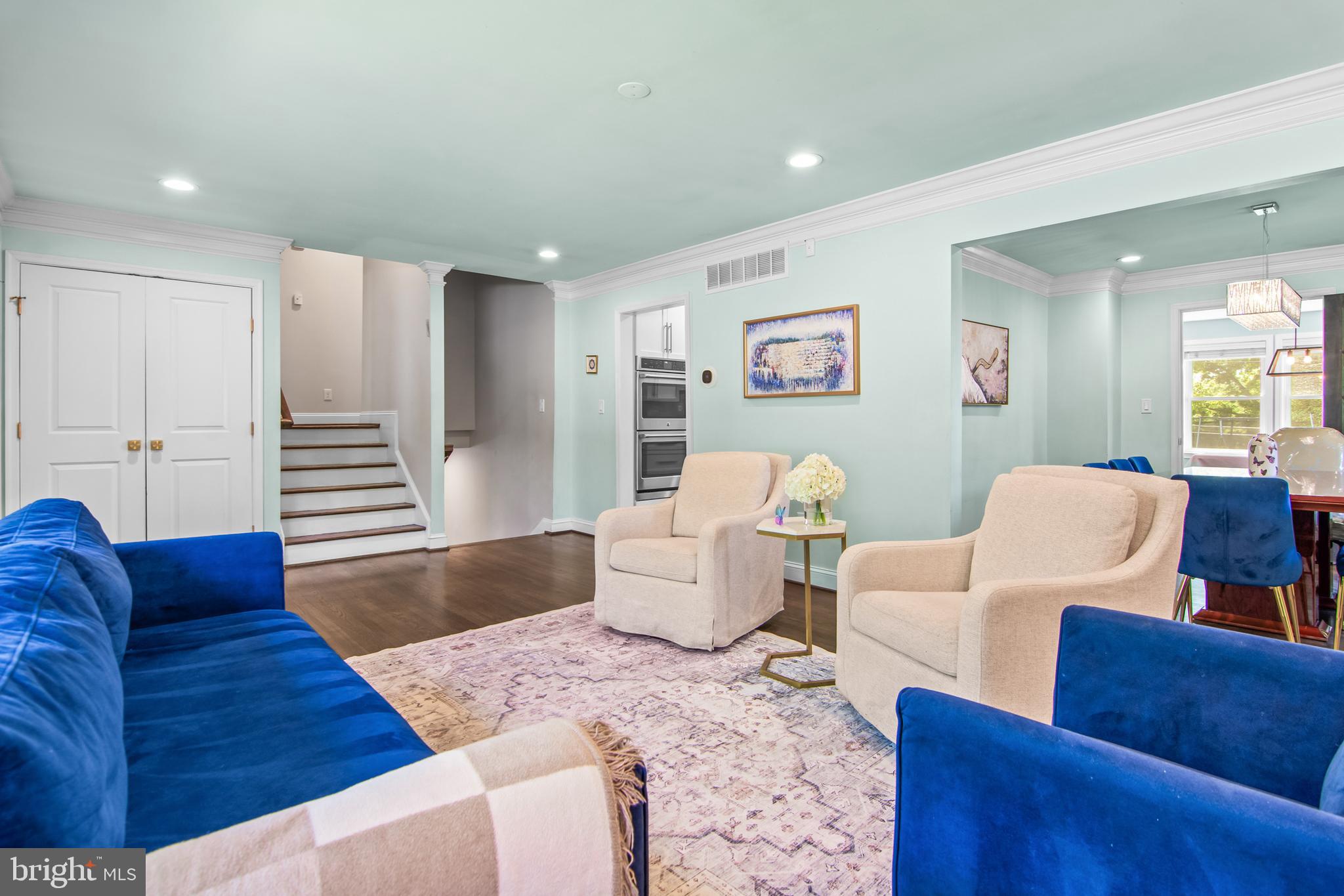 6308 Ivymount Road Baltimore, MD 21209 - Photo 3 of 22 a living room with furniture and wooden floor