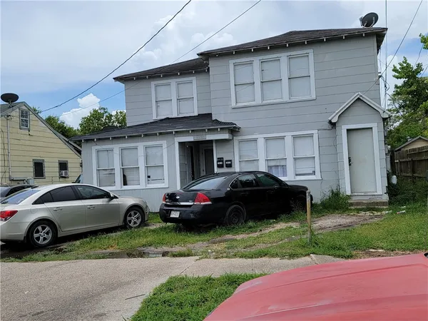 a car parked in front of a house