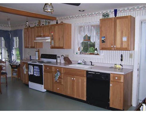 154 Fiberloid Street Springfield, MA 01151 - Photo 3 of 8 a kitchen with stainless steel appliances granite countertop a sink stove and refrigerator