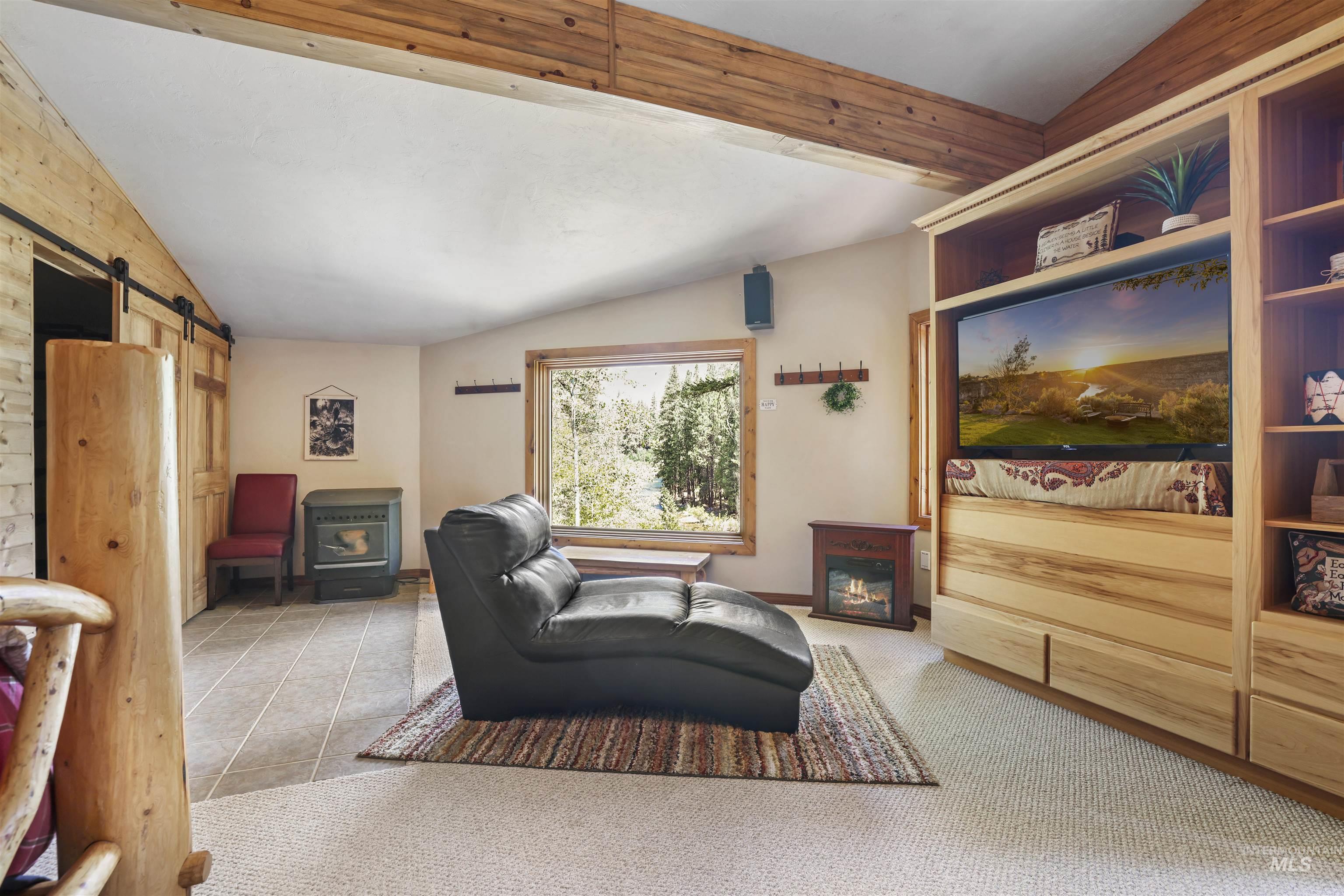 224 Dakota Road Mountain Home, ID 83647 - Photo 18 of 50 Angled ceiling with exposed wood beams