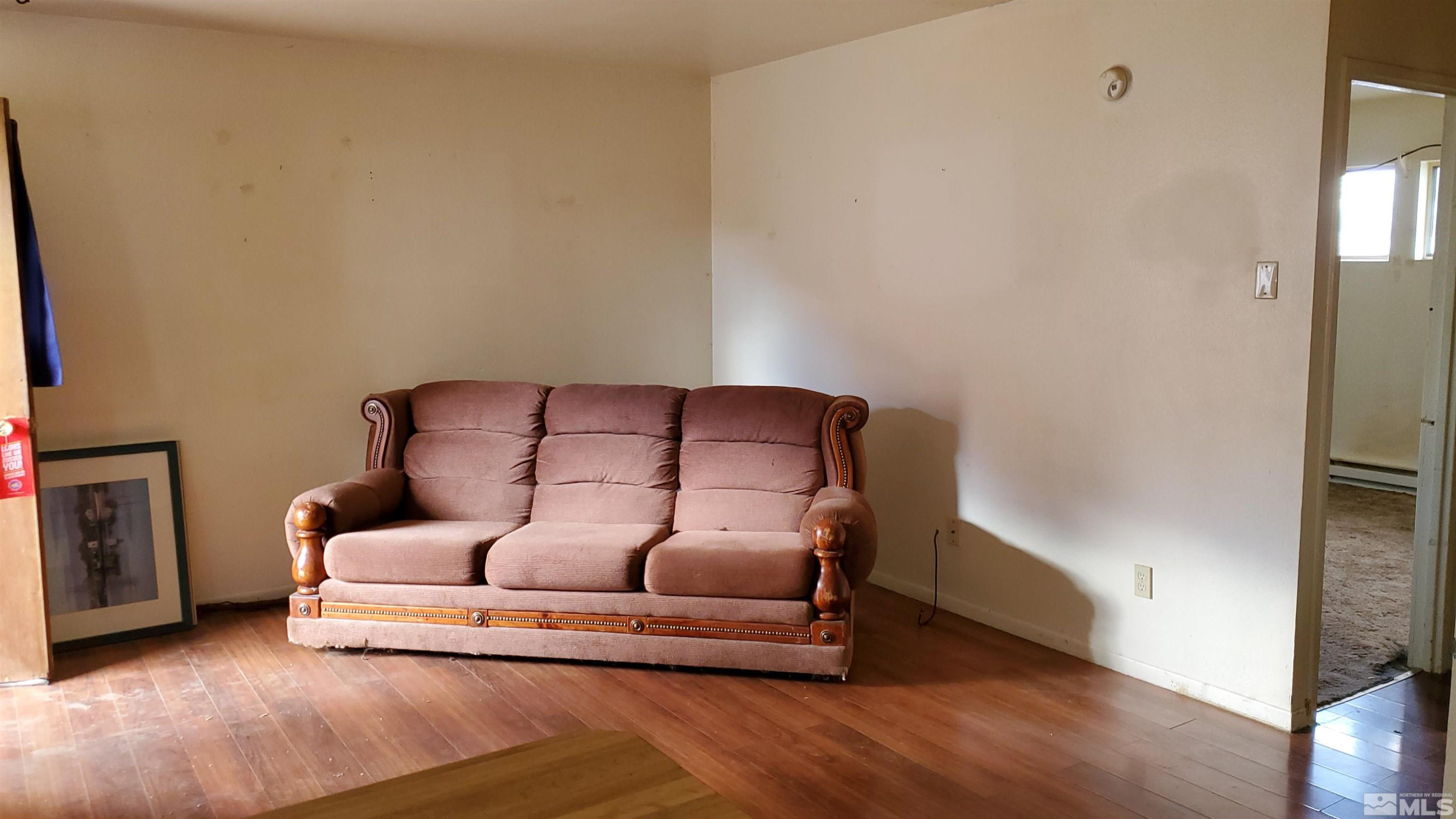 422 C Street Hawthorne, NV 89415 - Photo 2 of 5 a living room with furniture and a fireplace