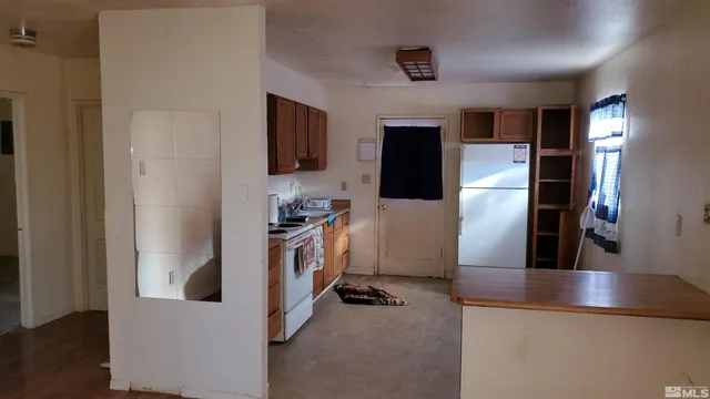 a view of a living room and a flat screen tv