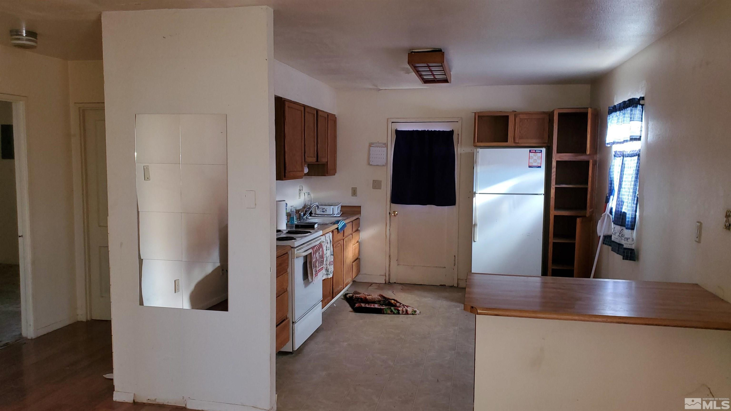 422 C Street Hawthorne, NV 89415 - Photo 3 of 5 a view of a living room and a flat screen tv