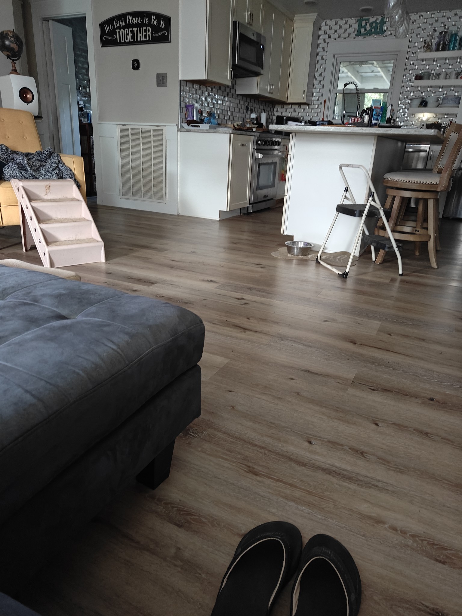 150 Sylvis Road Dickson, TN 37055 - Photo 10 of 61 a living room with stainless steel appliances kitchen island granite countertop a stove a sink a refrigerator white cabinets and wooden floor