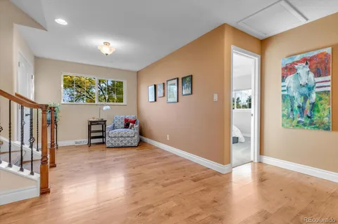 a bedroom with a bed mirror and window