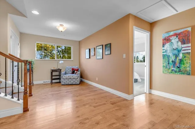a bedroom with a bed mirror and window