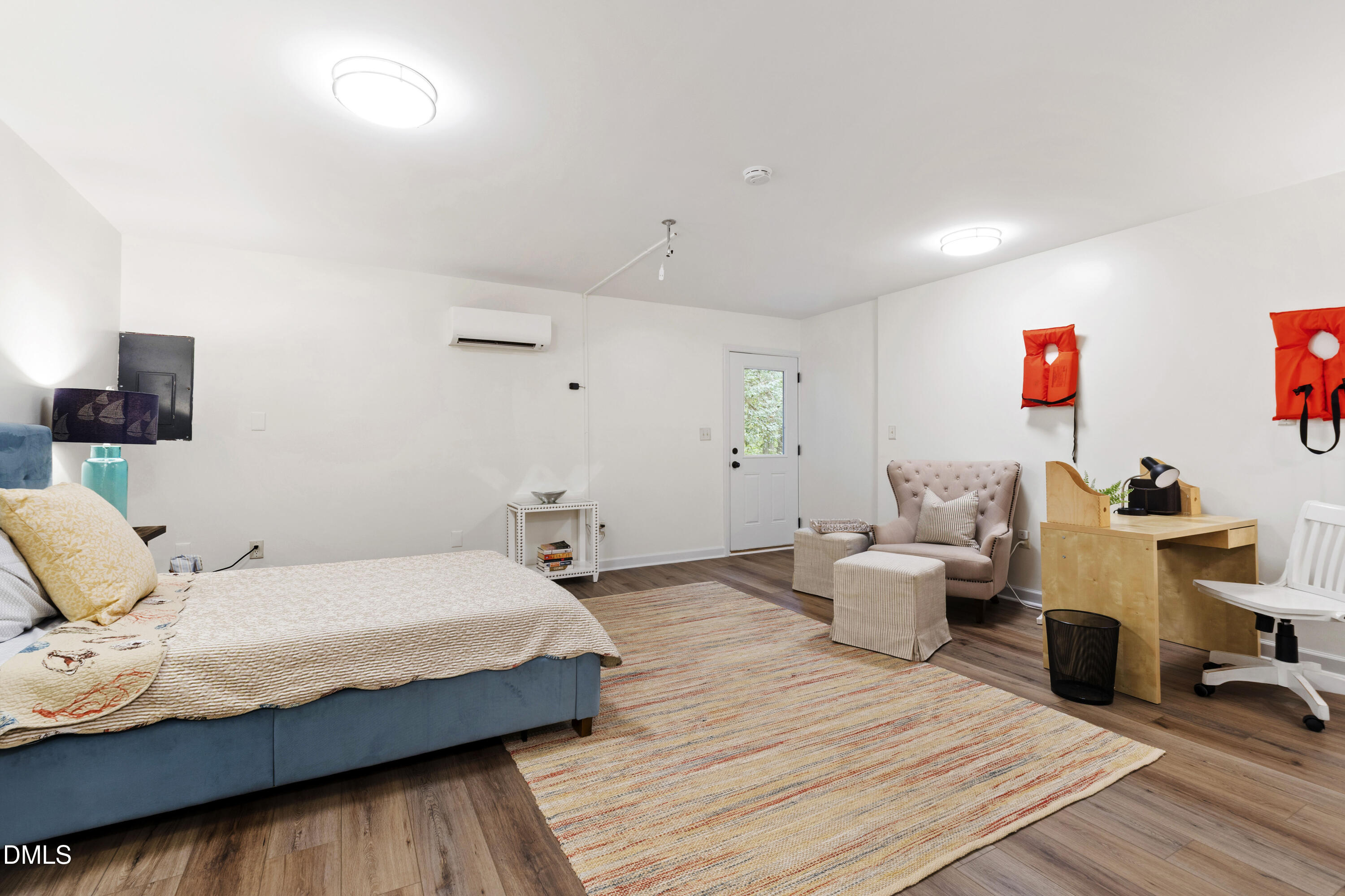 115 Inverness Court Cary, NC 27511 - Photo 25 of 40 a bedroom with a bed and wooden floor