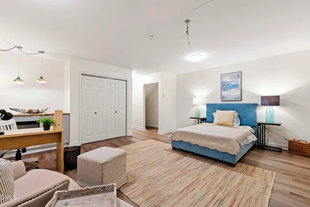 a bedroom with two beds and painted walls