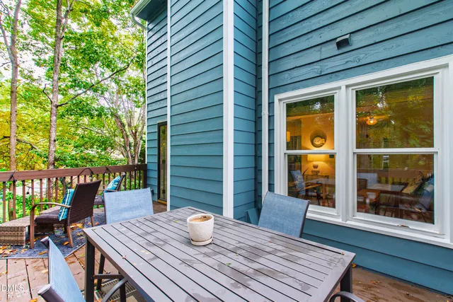 a view of balcony with furniture and wooden deck