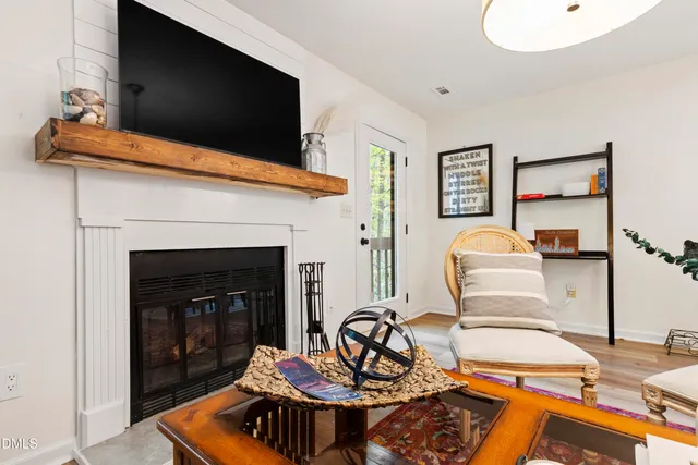 a living room with furniture and a fireplace