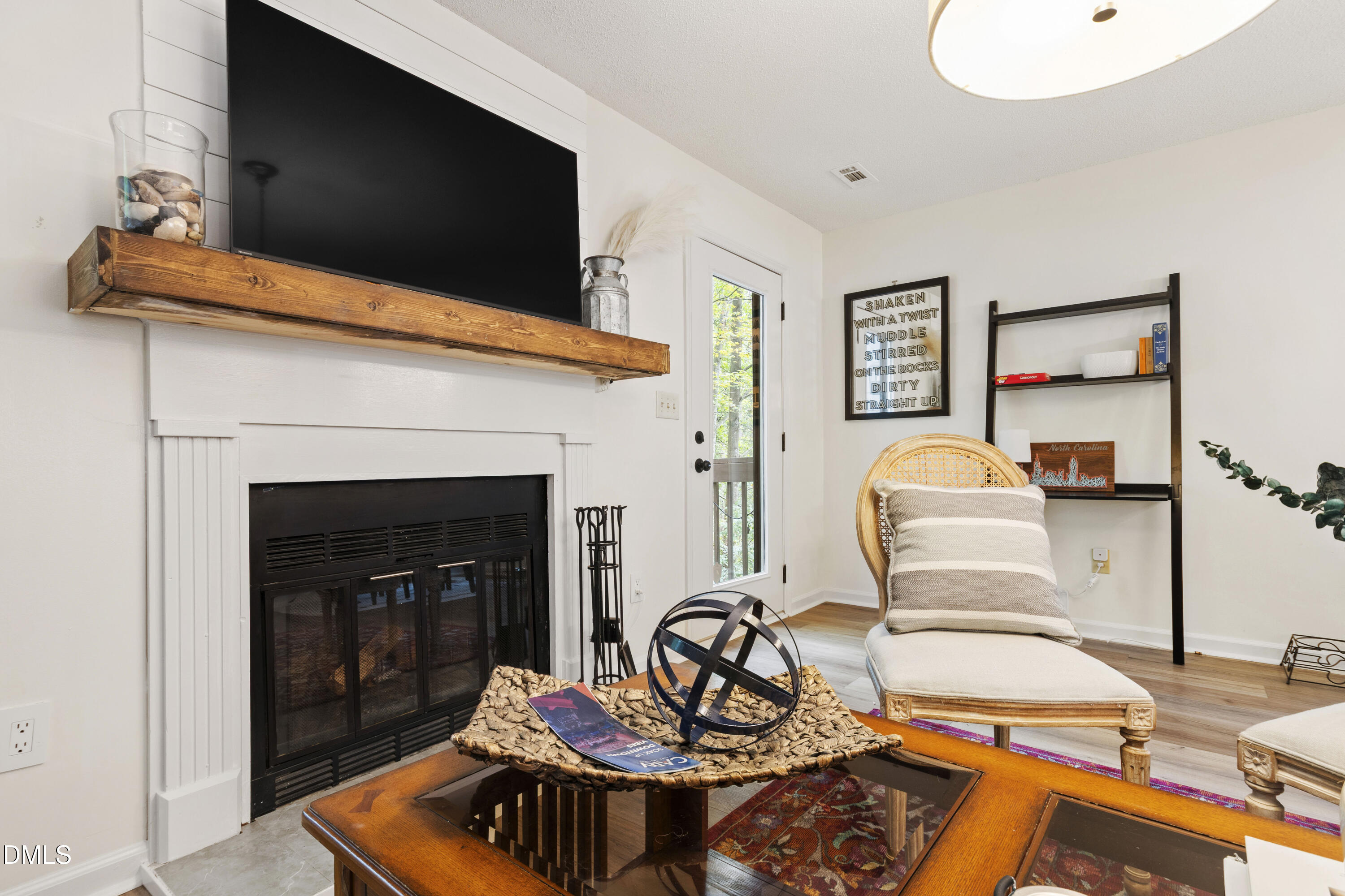 115 Inverness Court Cary, NC 27511 - Photo 5 of 40 a living room with furniture and a fireplace
