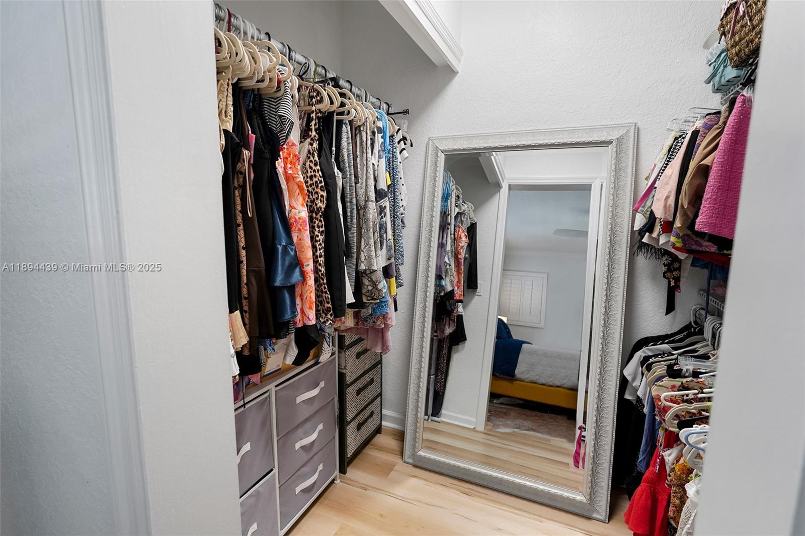 1201 South Riverside Drive, Unit 301 Pompano Beach, FL 33062 - Photo 12 of 24 a view of walk in closet with clothes and shoes