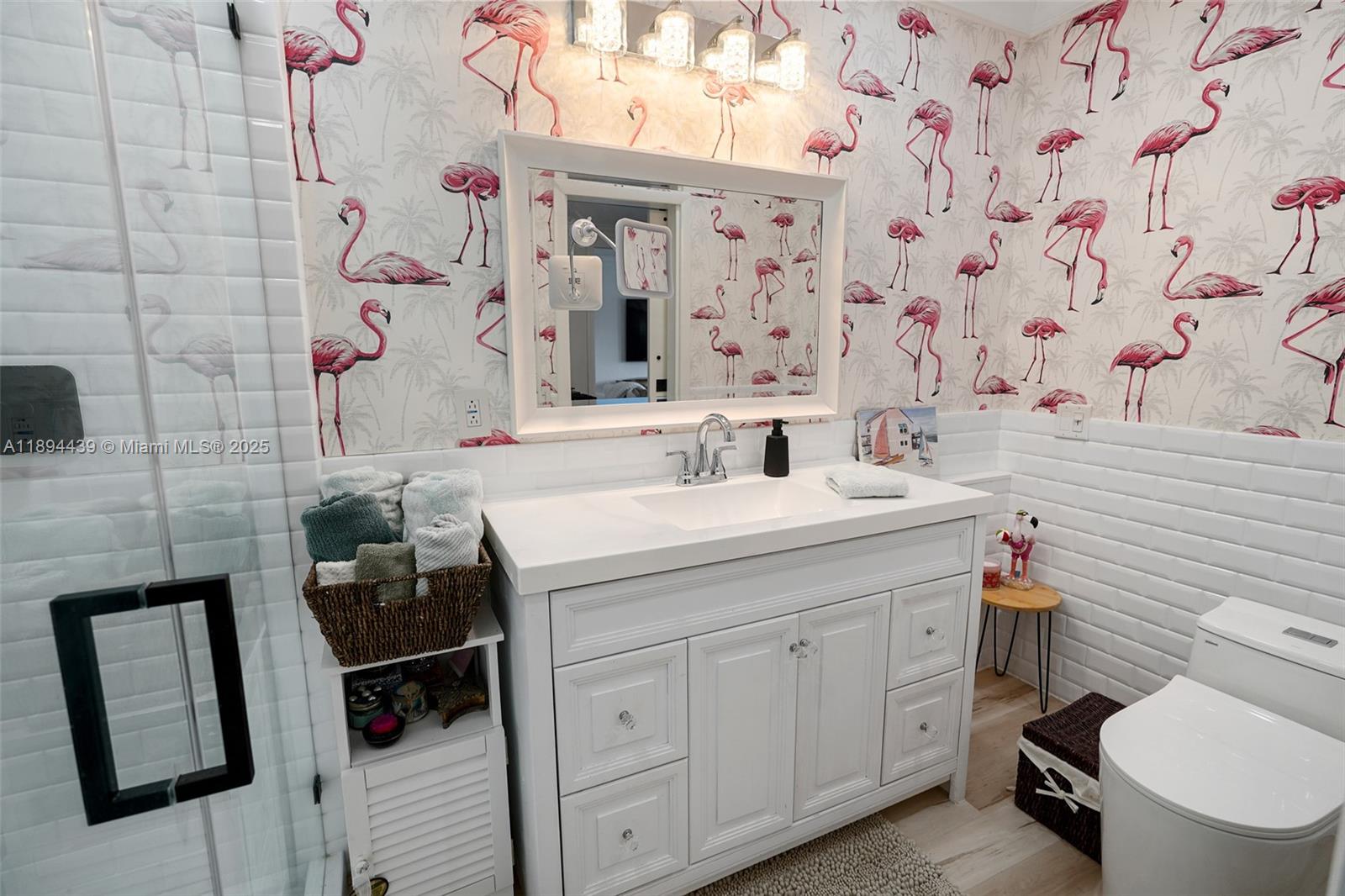 1201 South Riverside Drive, Unit 301 Pompano Beach, FL 33062 - Photo 14 of 24 a bathroom with a sink toilet vanity and shower