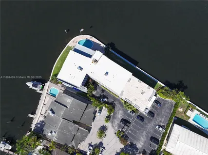an aerial view of house with yard